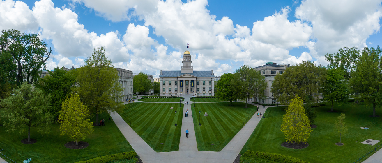The Pentacrest on a bright summer day with blue skies with the Old Capitol at the center